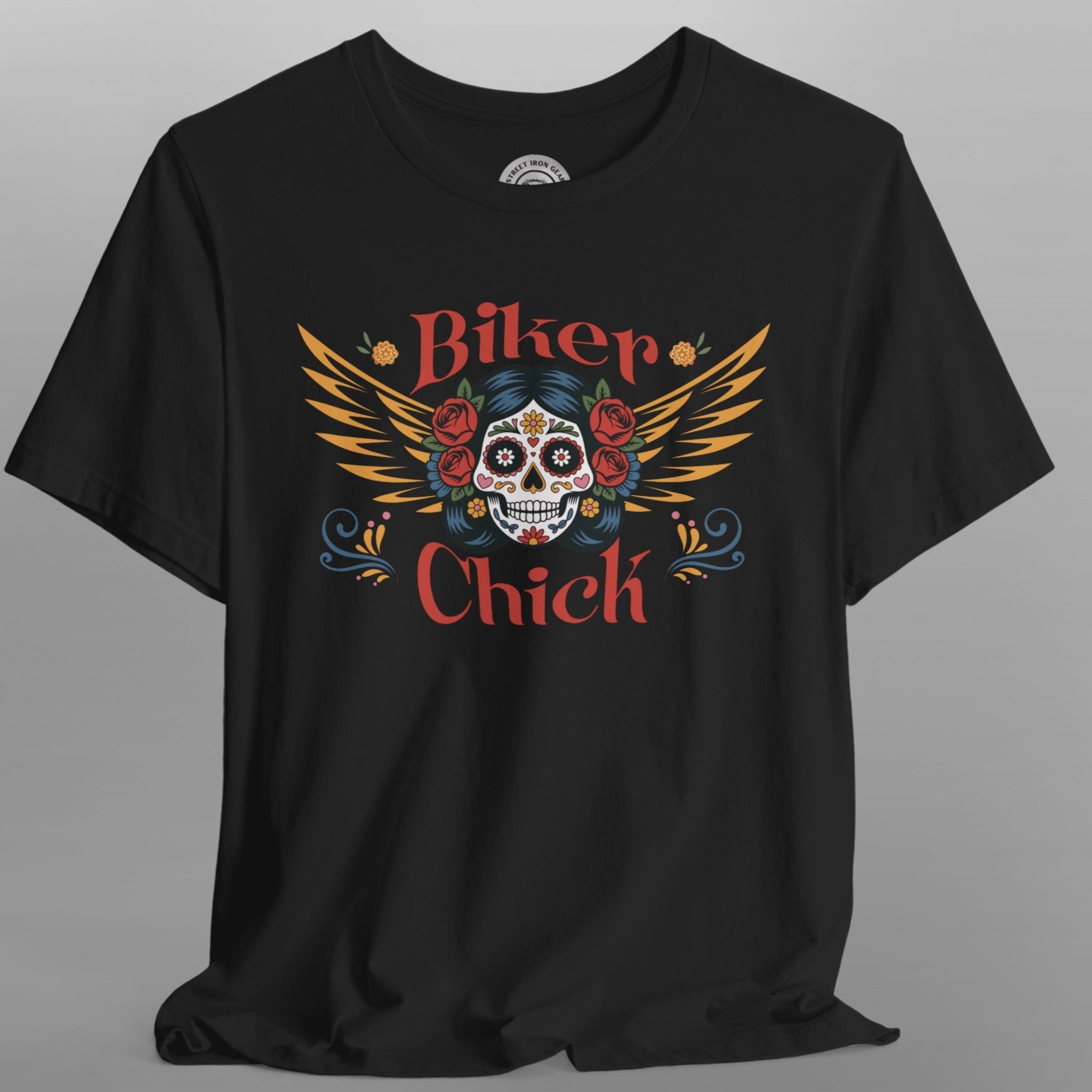 Black t-shirt with a colorful skull design and 'Biker Chick' text on a gray background