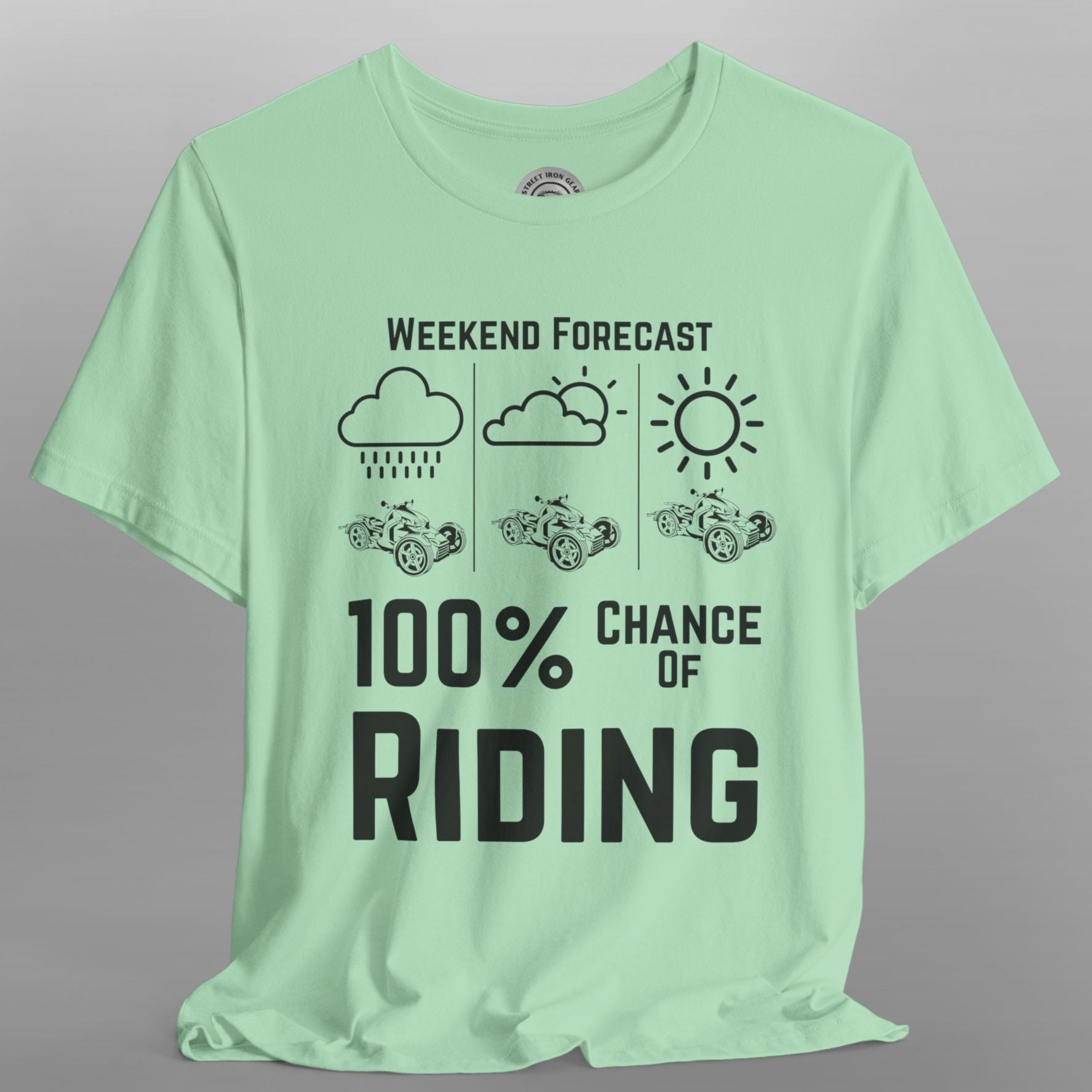 Light green t-shirt with black text and graphics on a gray background
