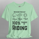 Light green t-shirt with black text and graphics on a gray background