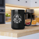 Black mug with 'Black Hills, SD' design on a kitchen counter