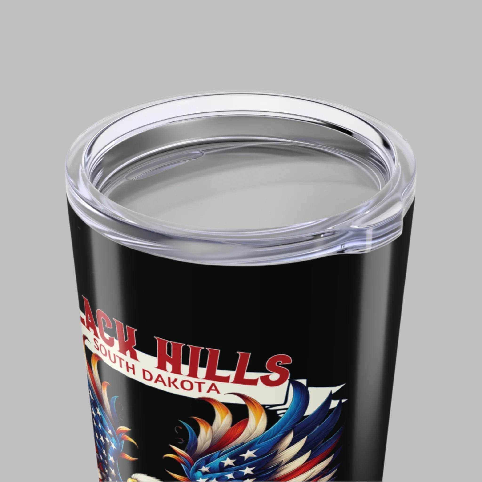 Black tumbler with 'Black Hills South Dakota' text and eagle design on a white background