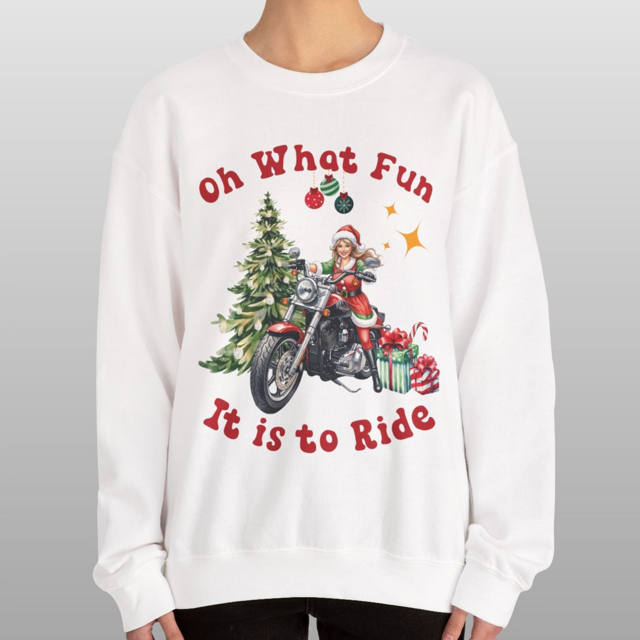 Person wearing a white sweatshirt with Christmas-themed design and text.