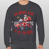 Person wearing a dark gray sweatshirt with a festive design of Santa Claus on a motorcycle and text.