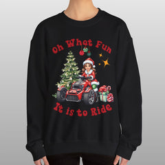Person wearing a black sweatshirt with Christmas-themed design and text.