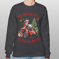 Person wearing a black sweatshirt with Christmas-themed design and text.