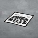 Black and white patch with 'The Black Hills South Dakota' text on a gray surface