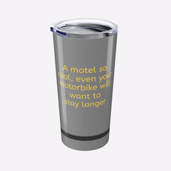 Gray tumbler with yellow text on a white background