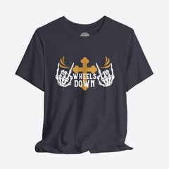 A black crew neck t-shirt with a graphic print of skeleton hands, a gold cross, and the text 'Wheels Down'.