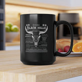 Black mug with white text and design on a kitchen counter