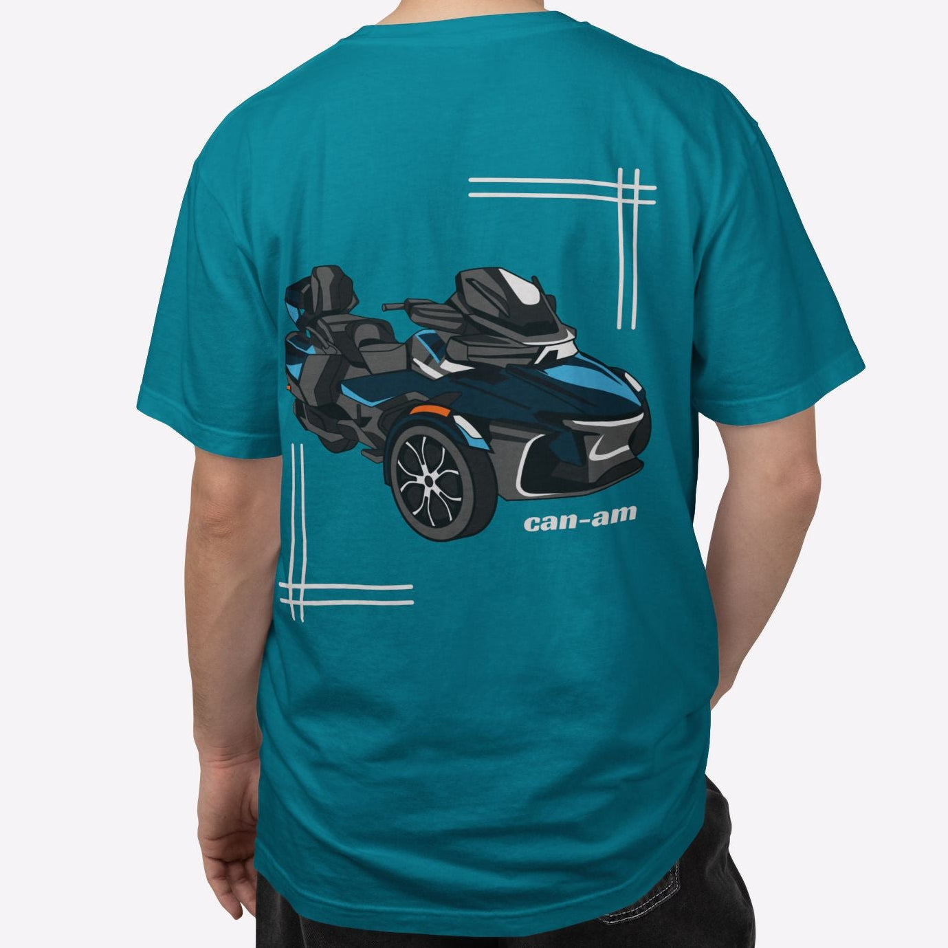 Person wearing a teal t-shirt with a graphic design on the back, standing against a white background