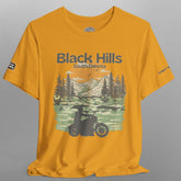 Yellow t-shirt with Black Hills South Dakota graphic on a gray background