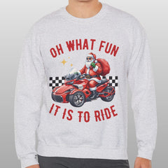 Person wearing a gray sweatshirt with a graphic design and text on a plain background