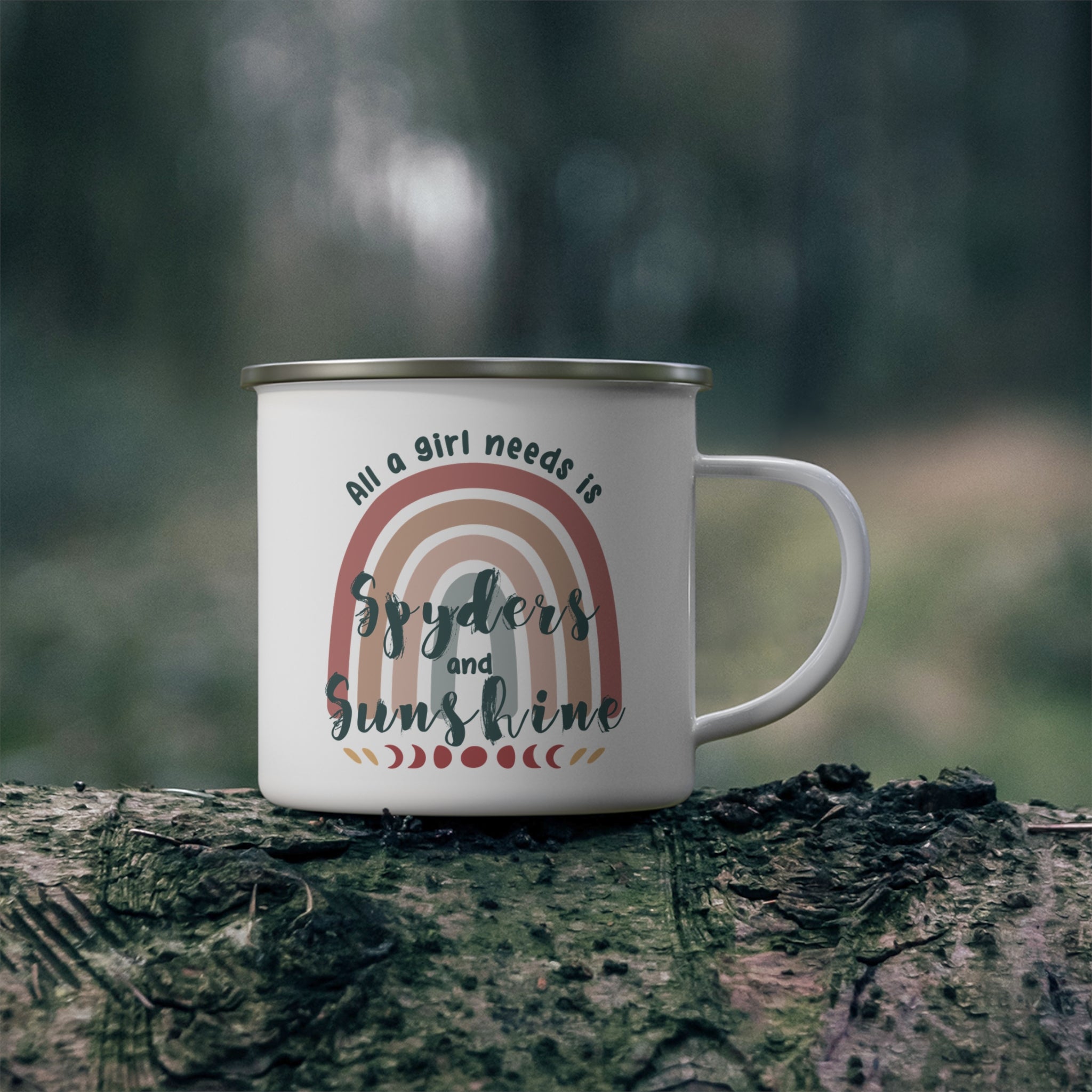 White mug with rainbow design and text on a tree stump with a blurred forest background