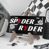 Spyder Ryder license plate with tools and car parts on a workbench