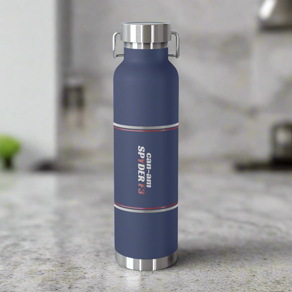 Blue water bottle with silver lid and accents on a white background