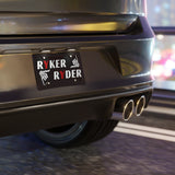 Car rear with 'RYKER RIDER' license plate in a blurred indoor setting