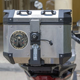 Motorcycle luggage box with a visible brand logo on a blurred background