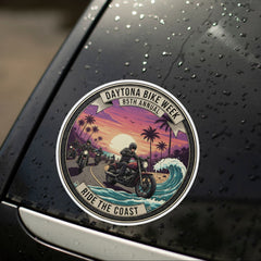 Car sticker with a motorcycle design on a wet car surface