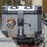 Motorcycle luggage box with a Daytona Bike Week sticker on a blurred background