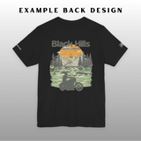 Black t-shirt with a scenic design of mountains and trees on a gray background