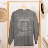 Gray long-sleeve shirt with graphic design on a wooden rack in a room setting.