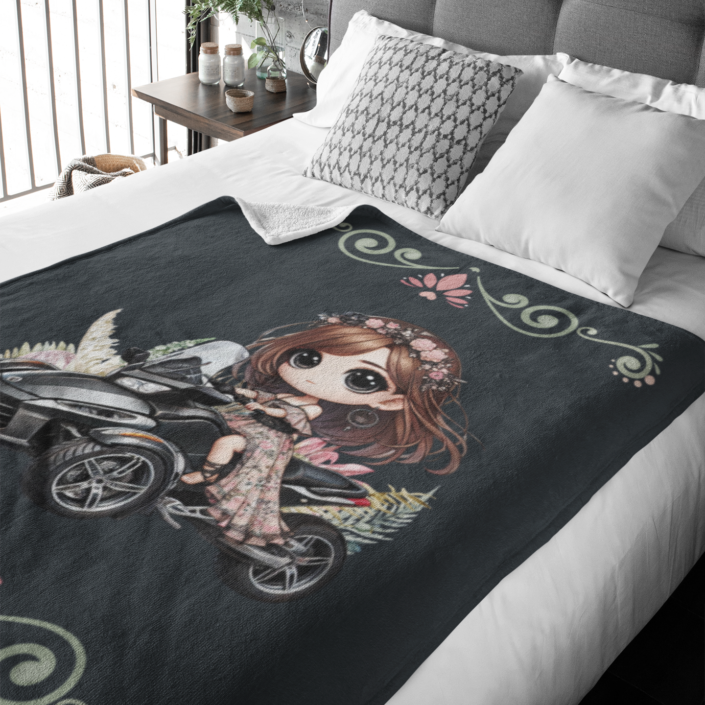 Bed with a decorative blanket featuring an illustration of a girl on a bicycle.