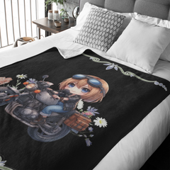 Bed with an anime-style character blanket featuring a girl with goggles and motorcycle-themed design.