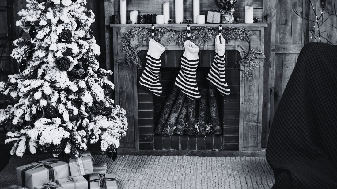 Christmas tree with stockings hung by fire place