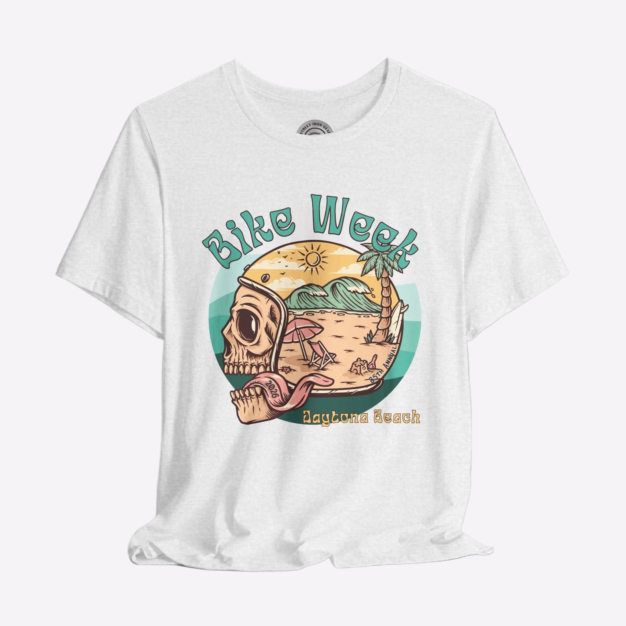 White t-shirt with a graphic design featuring a skull, beach scene, and 'Bike Week Daytona Beach' text on a gray background.
