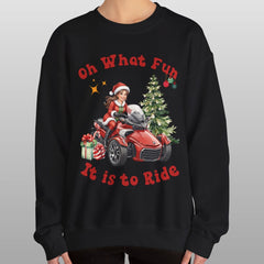 Person wearing a black Christmas-themed sweatshirt with graphics and text.