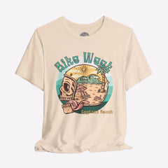 Beige t-shirt with a graphic design featuring a skull, beach scene, and 'Bike Week Daytona Beach' text on a gray background.