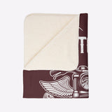 Blanket with a design of a winged helmet on a white background