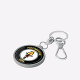 Keychain with 'Motorcycle Inn' logo on a white surface