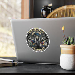 Laptop with a Daytona Bike Week sticker on a desk with a plant and pen.