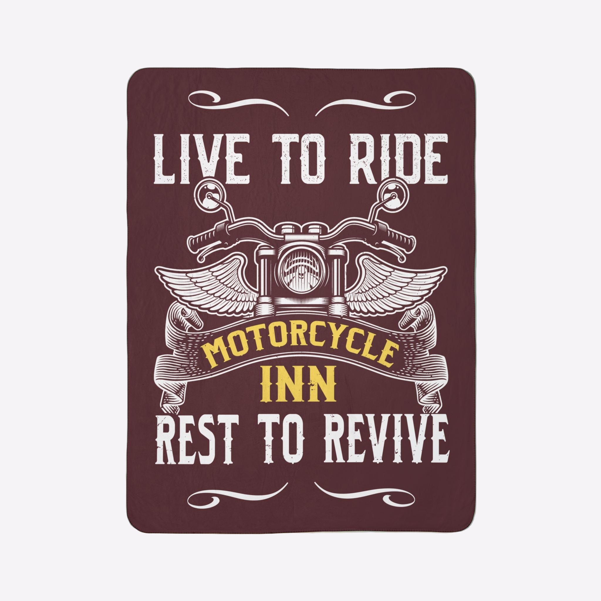 Decorative sign with motorcycle design and text 'Live to Ride, Motorcycle Inn, Rest to Revive' on a green wall.