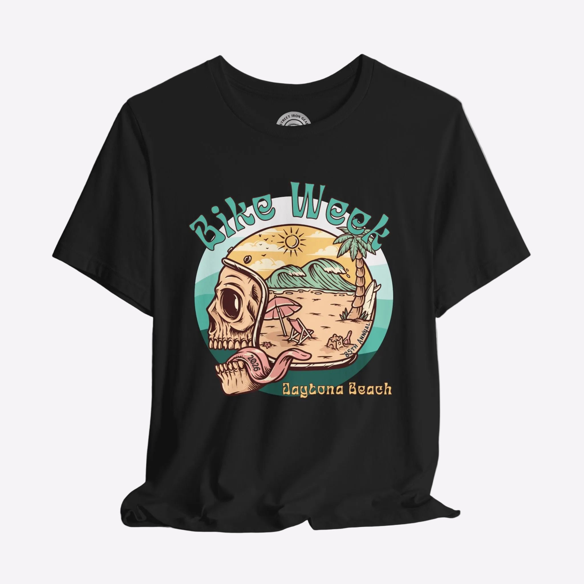 Black t-shirt with a graphic design of a skull, beach scene, and 'Bike Week Daytona Beach' text on a gray background.
