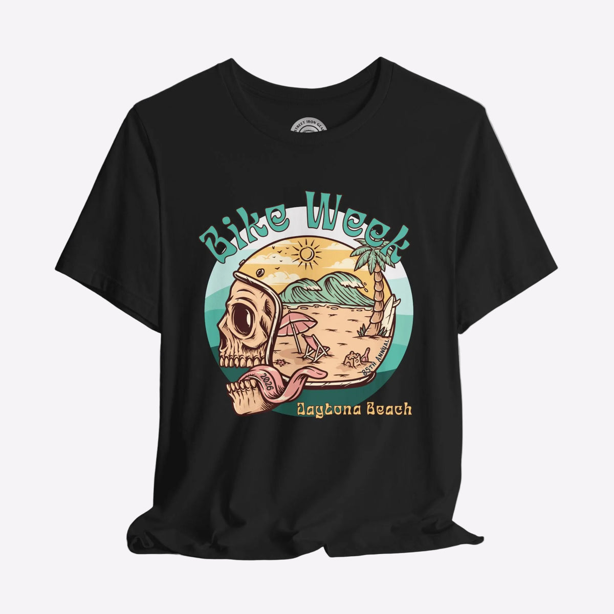 Black t-shirt with a graphic design of a skull, beach scene, and 'Bike Week Daytona Beach' text on a gray background.
