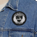 Person wearing a blue denim jacket with a patch on a white background