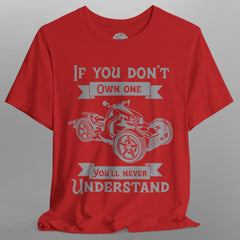 Red t-shirt with graphic design and text on a gray background