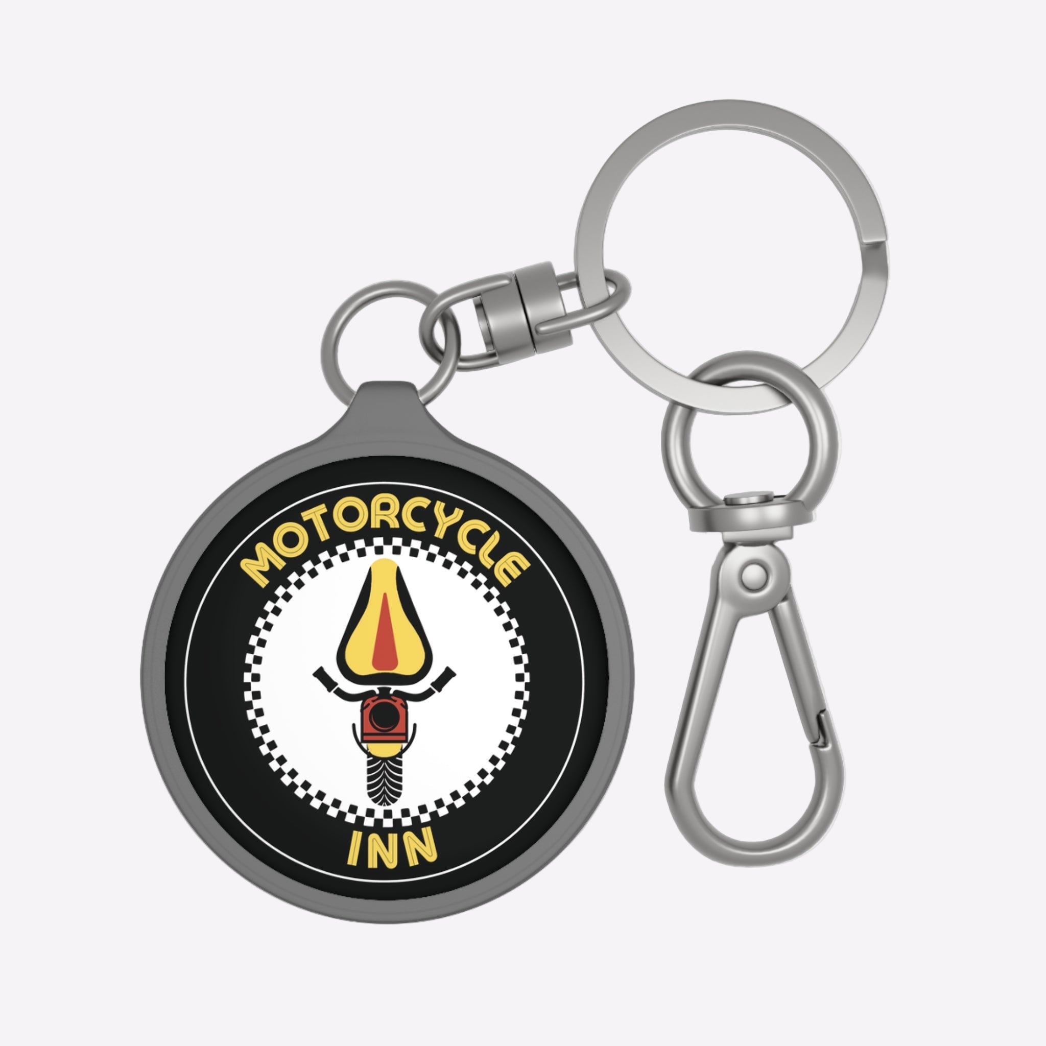 Keychain with 'Motorcycle Inn' logo on a white background