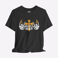 A black crew neck t-shirt with a graphic print of skeleton hands, a gold cross, and the text 'Wheels Down'.