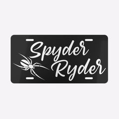 Black license plate with 'Spyder Ryder' text and spider design on a white background