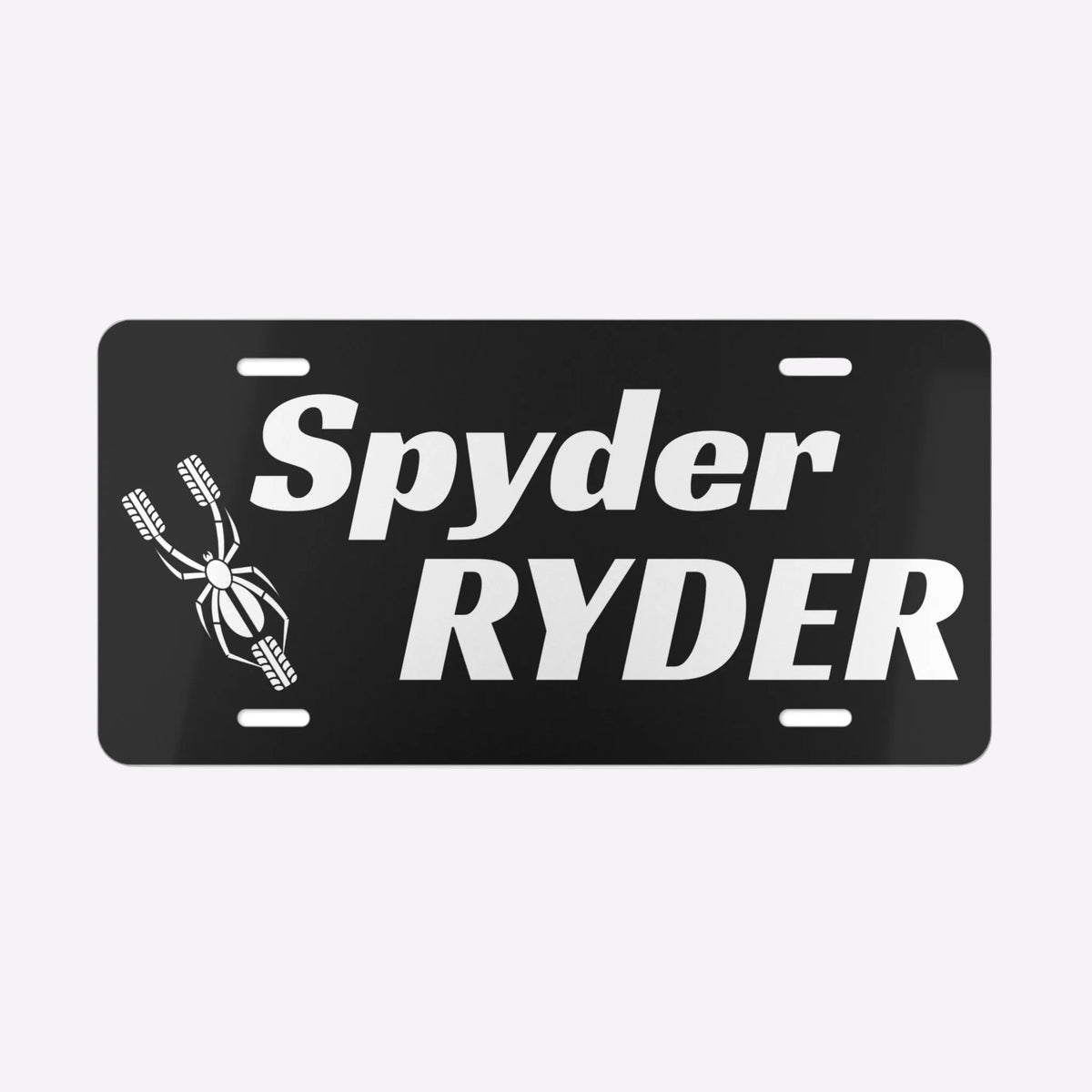 Black license plate with 'Spyder Ryder' text on a white background