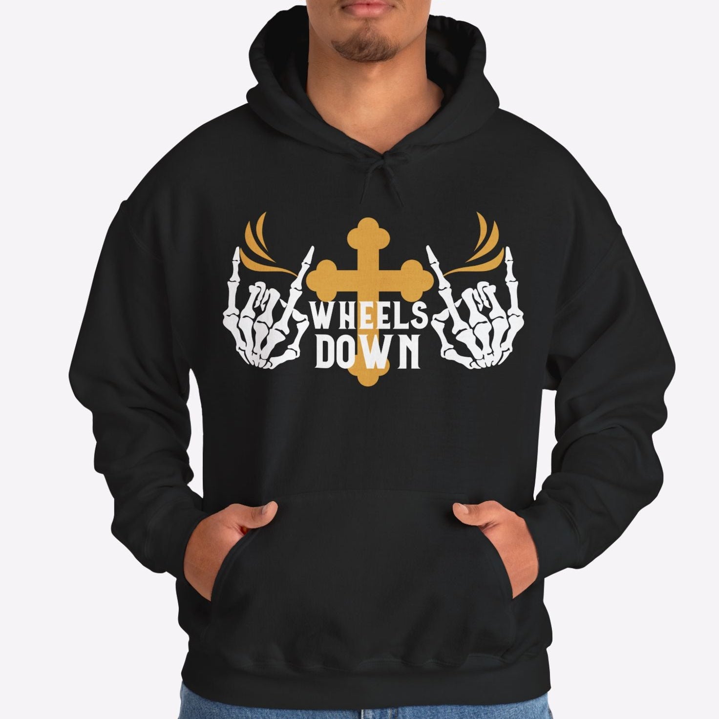 Person wearing a black hoodie with a graphic design on a white background