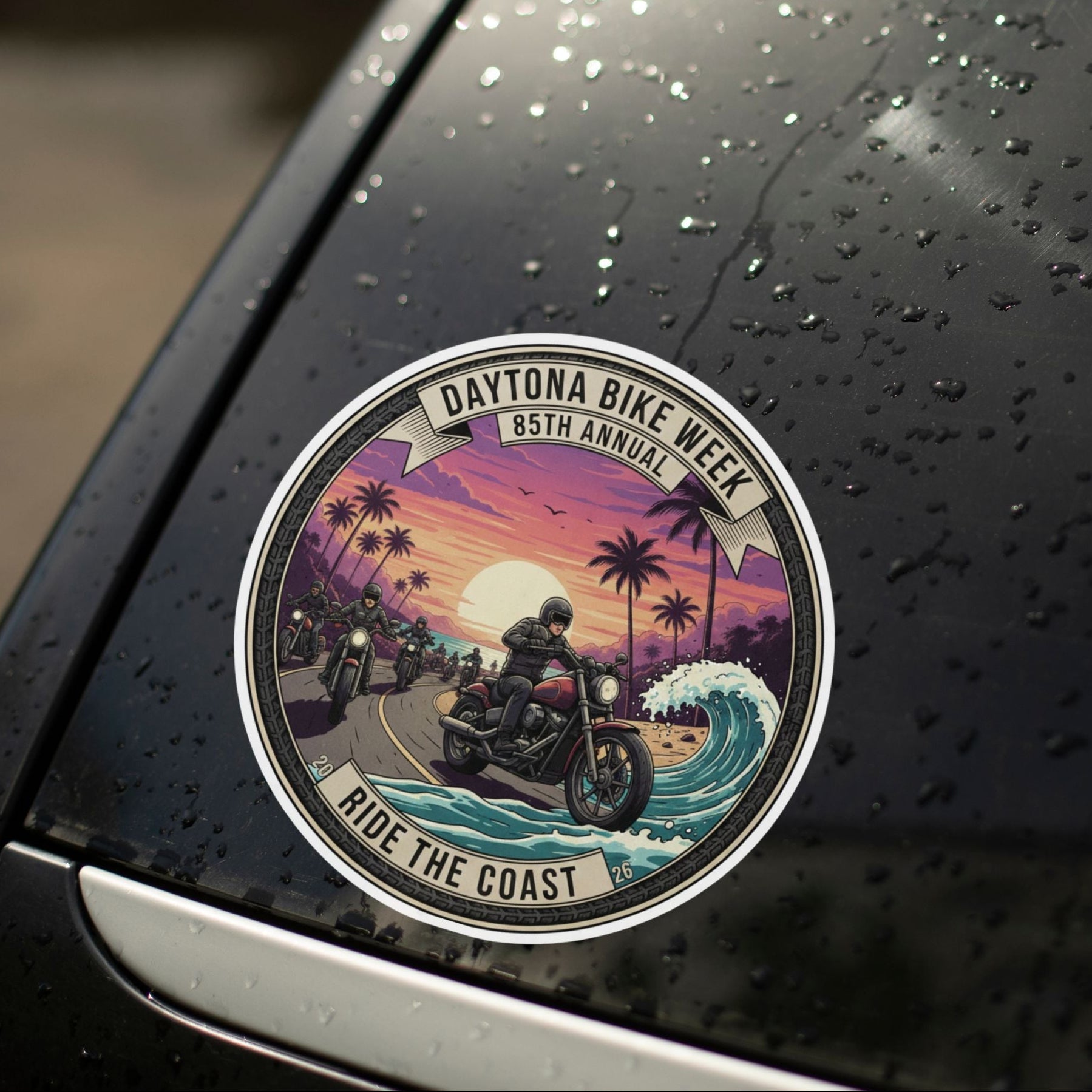 Car sticker with a motorcycle design on a wet car surface