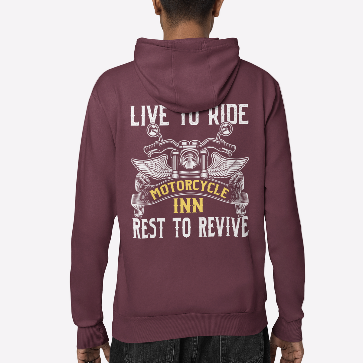 Person wearing a maroon hoodie with text and graphics on the back, on a white background