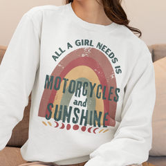 Person wearing a white sweatshirt with a colorful graphic and text.