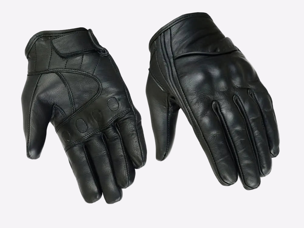 Pair of black leather gloves on a white background